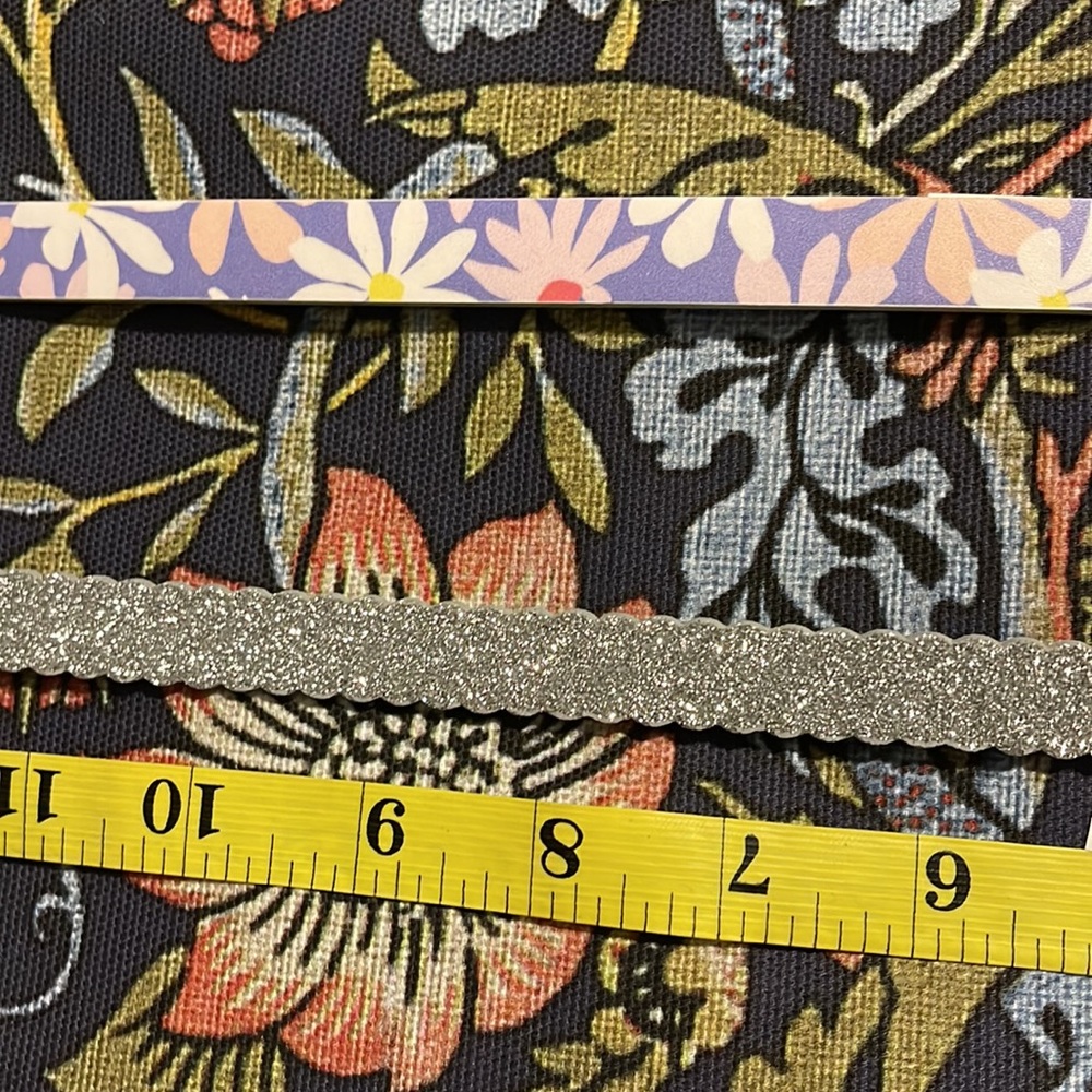 Two Cat & Jack girls belts. L. New. 33” from buckle to tip. Glitter and floral.